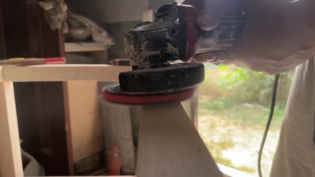 grinding a dowel driven into a block. High quality 4k footage