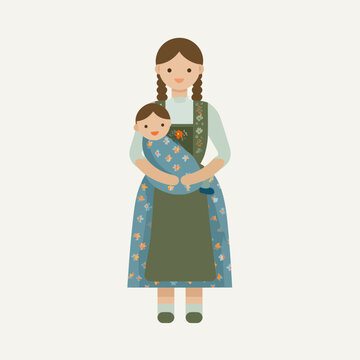 Mother holding baby in traditional Bavarian dress