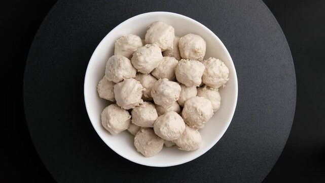 Pork tendon meatballs in white bowl.(Thai Pork Tendon Balls).Top view.