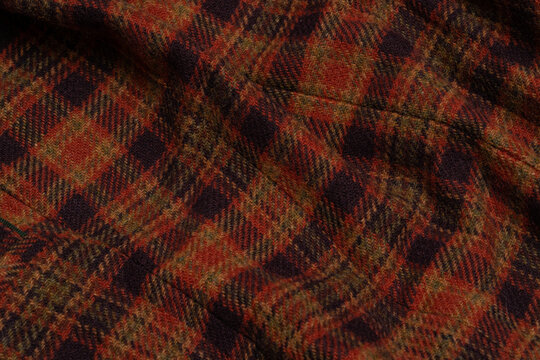 Red plaid wool fabric texture background