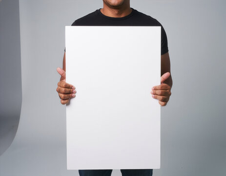 Large blank poster mockup template held by person in studio