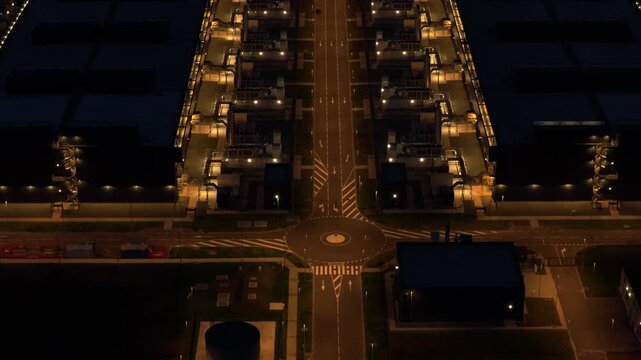 Aerial view of data center with cooling towers at night