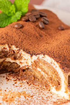Homemade tiramisu cake topped with cocoa powder