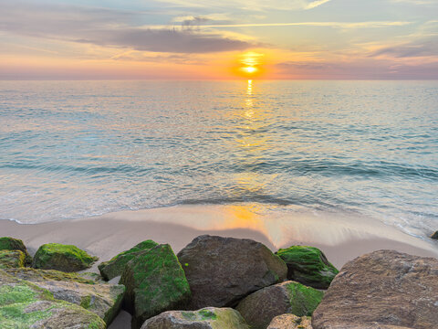 Golden sunset over Atlantic ocean at Furadouro beach
