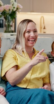 Laughing, watching tv and relax with family on sofa in home for streaming service, cartoon channel and bonding. Funny show, connection and kids movie with parents and children in living room of house