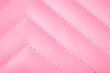 Obraz premium Pink soft textured quilted surface with diagonal stitching creating a repetitive chevron design