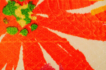 Colorful exotic leather background with painted floral pattern on python skin texture © reddish