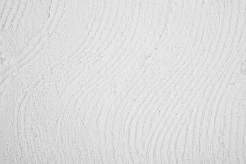 textured white wall surface with curved lines © reddish