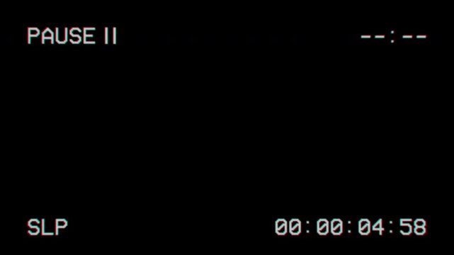 Vintage analog video player pause overlay on black background