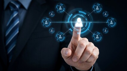 Obraz premium A businessman's finger touches a digital interface, connecting him to a network of user icons. The image represents digital connection and human resources
