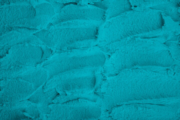 Textured teal plaster wall surface detail © reddish