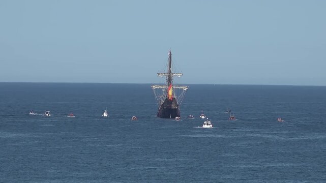 Historic Galleon with Spanish flag sailing close to the coast of Ireland in County Donegal