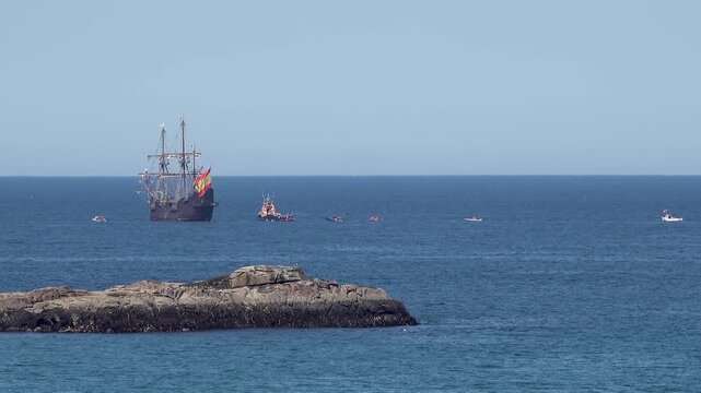 Historic Galleon with Spanish flag sailing close to the coast of Ireland in County Donegal