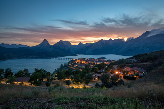 Ria&ntilde;o Reservoir with the city lit up at night, Le&oacute;n, Castile and Le&oacute;n, Spain