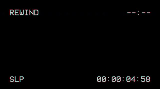 Vintage vhs rewind interface with digital timecode on black