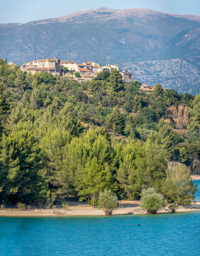 Sainte-Croix-du-Verdon, France - 07 05 2026: Panoramic view of the Lake Sainte-Croix, Sainte-Croix-du-Verdon village, hills and forests in sunny blue sky