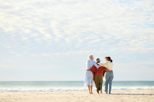 Friends Walks Along the Beach Near the Ocean