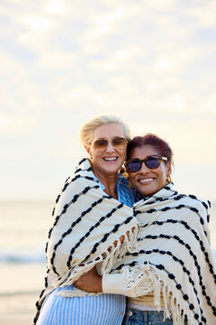 Friends Smiling in Beach Blankets
