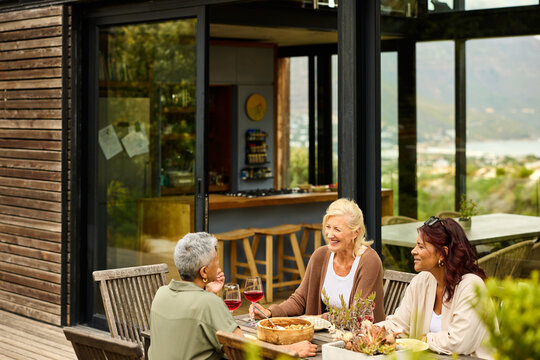 Friends Meet for Outdoor Drinks in luxury house