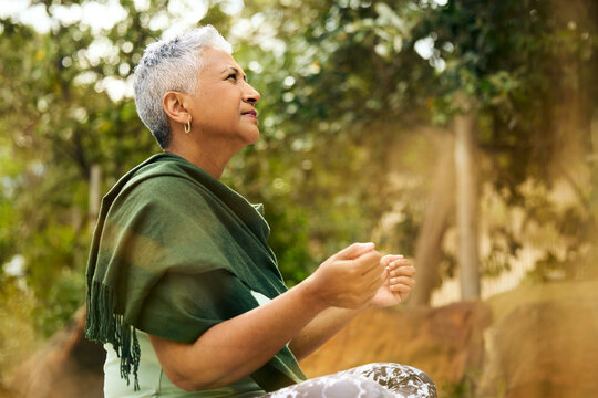 Woman Meditates in Garden