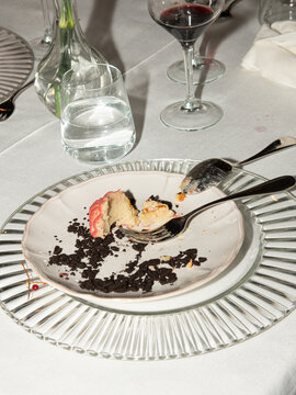 Partially Eaten Mini Bundt Cake Dessert with Wine Glasses