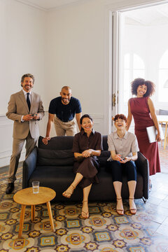 Business team smiling in creative office space