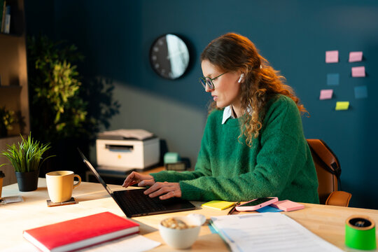 Focused on Work at a Laptop