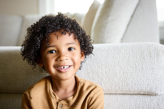 Child Smiles at Home With Comfort and Joy