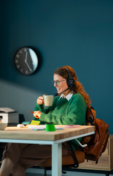 Enjoying Coffee During a Video Call