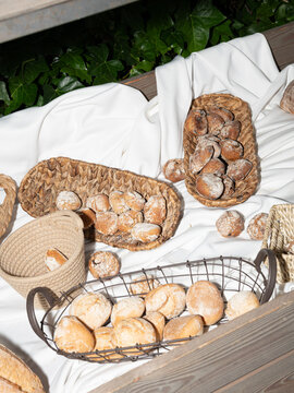 Artisan Bread Rolls Displayed in Rustic Baskets