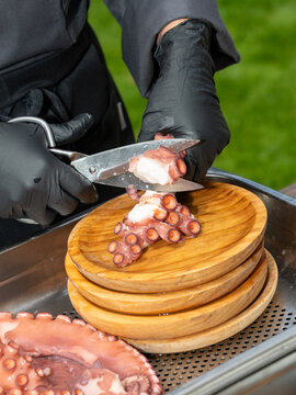 Seafood Chef Portioning Octopus Tentacle