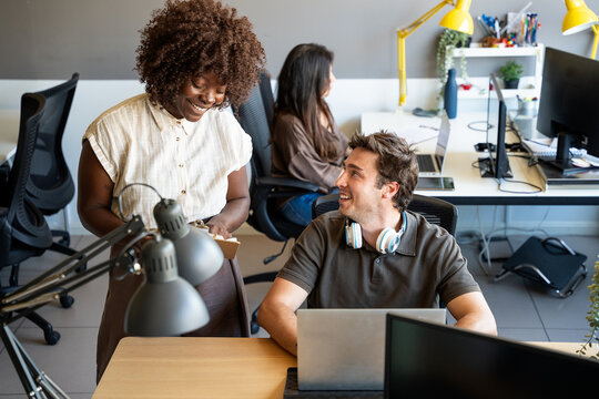Colleagues cooperating in a modern office workplace