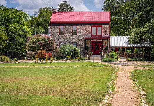 Salado, TX - 10 July 2026: Exterior view of the historic stone building known as Barton House, operated as a restaurant.