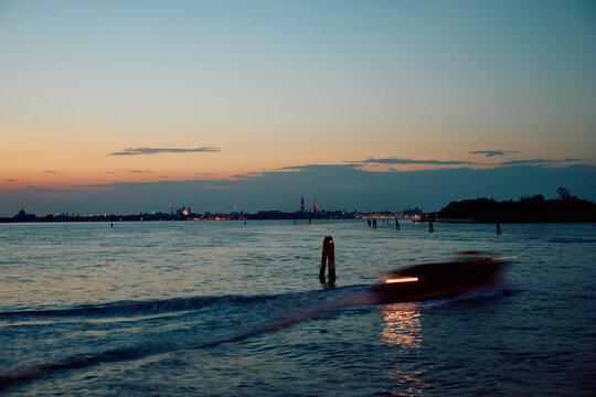 Venice panorama with boat in evening