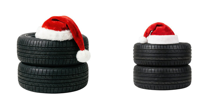 Two stacks of car tires wearing santa hats isolated on transparent background