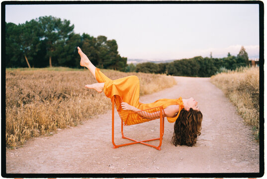 Woman relaxing on modern chair 