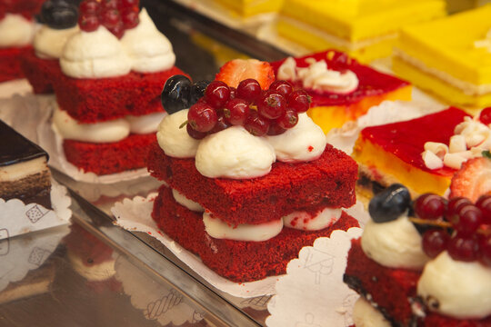 Red velvet cakes. Assortment of traditional Sicilian pastries with marzipan and candied fruit.