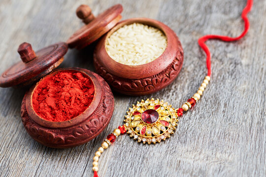 Raksha bandhan rakhi with sindoor and rice grains