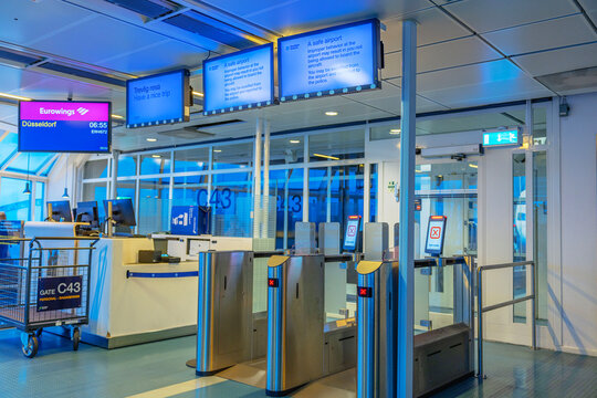 Close up view of Gate C43 boarding area with Eurowings departure screens at airport terminal. Arlanda. Sweden.