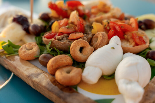 Traditional Apulian appetizer board with burrata and bruschetta, Italy
