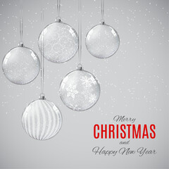 Silver christmas ornaments hanging with snowflakes and festive greetings for the holidays ©  SABBIR 