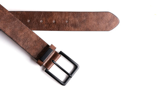 Stylish brown textured leather belt with black metal buckle isolated on white background.