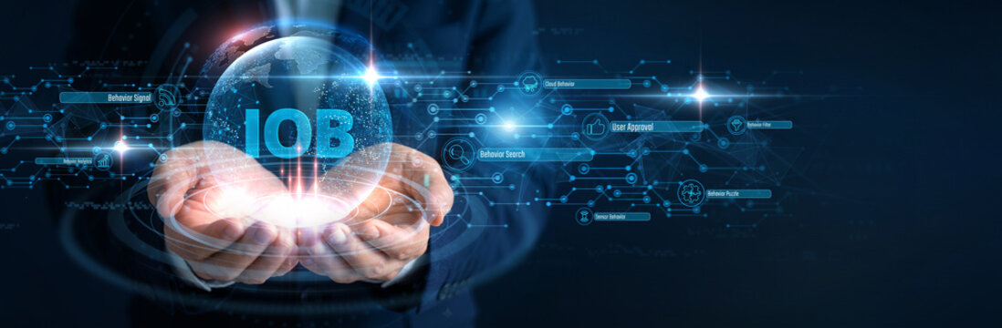 Behavioral Data Analyst Hand hold Internet of Behaviors and global networking, consumer IoB digital tracking metrics, human computer data interaction analysis, target marketing insight