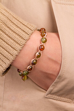 Model with stone bracelet