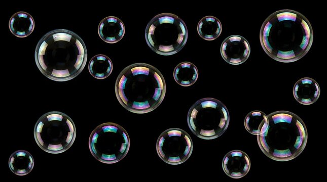 Colorful soap bubbles floating on a black background with iridescent rainbow reflections and various sizes perfect for abstract art and creative designs