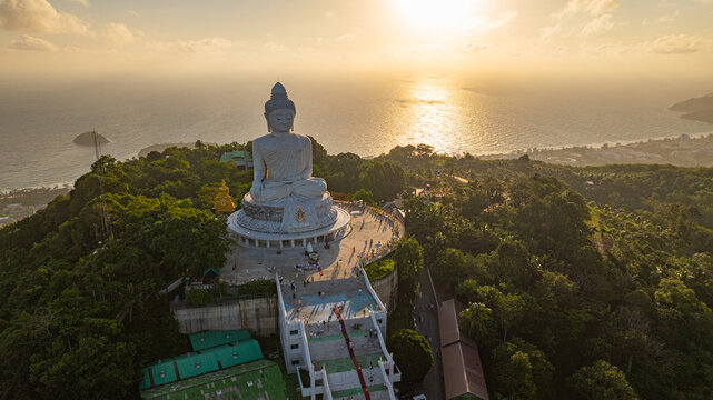 Aerial view of Scenic view of the Big Buddha Temple in Phuket featuring impressive architecture, beautiful cloud formations, and travelers enjoying the peaceful atmosphere.