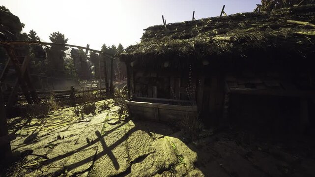 Broad view of sunlit homestead yard with thatch roofs and scattered tools, long fence shadows cross rough grass, wheel and trough near entrance, tranquil