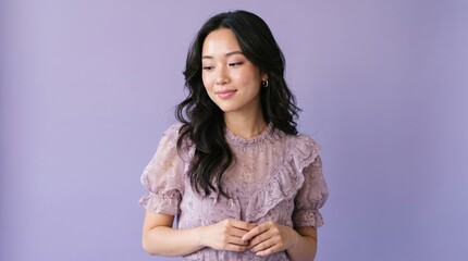 Fototapeta premium Young asian woman with long wavy hair posing against purple background portrait background beautiful lifestyle expression clothing cheerful confidence wellness skincare attractive feminine