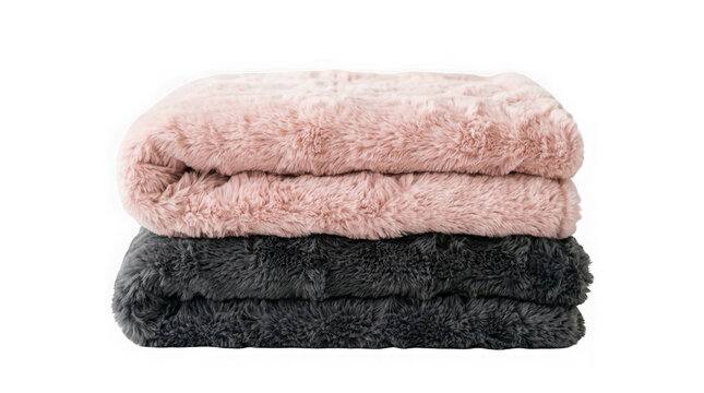 Soft and fluffy pink and dark gray faux fur blankets folded and stacked isolated on transparent background