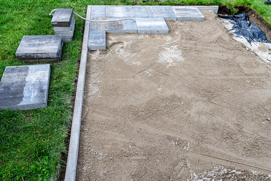 Paving slabs installation work on subgrade foundation